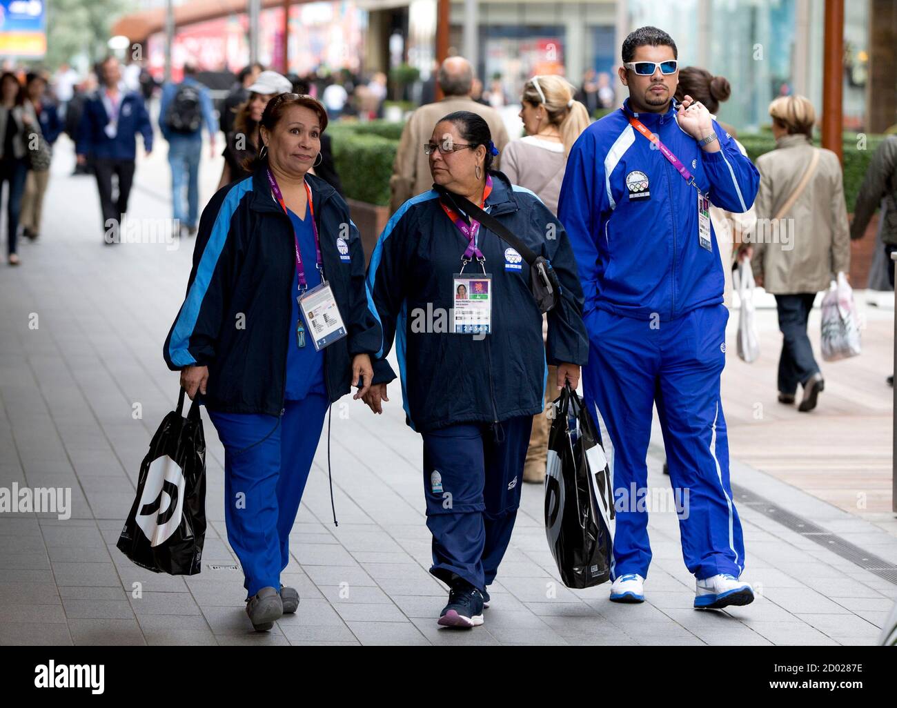 Members of the Honduras Olympic Team walk in the Westfield Shopping Centre, a major gateway for visitors to the London 2012 Olympic Park, in Stratford, east London, July 19, 2012. REUTERS/Neil Hall (BRITAIN - Tags: SPORT OLYMPICS) Stock Photo