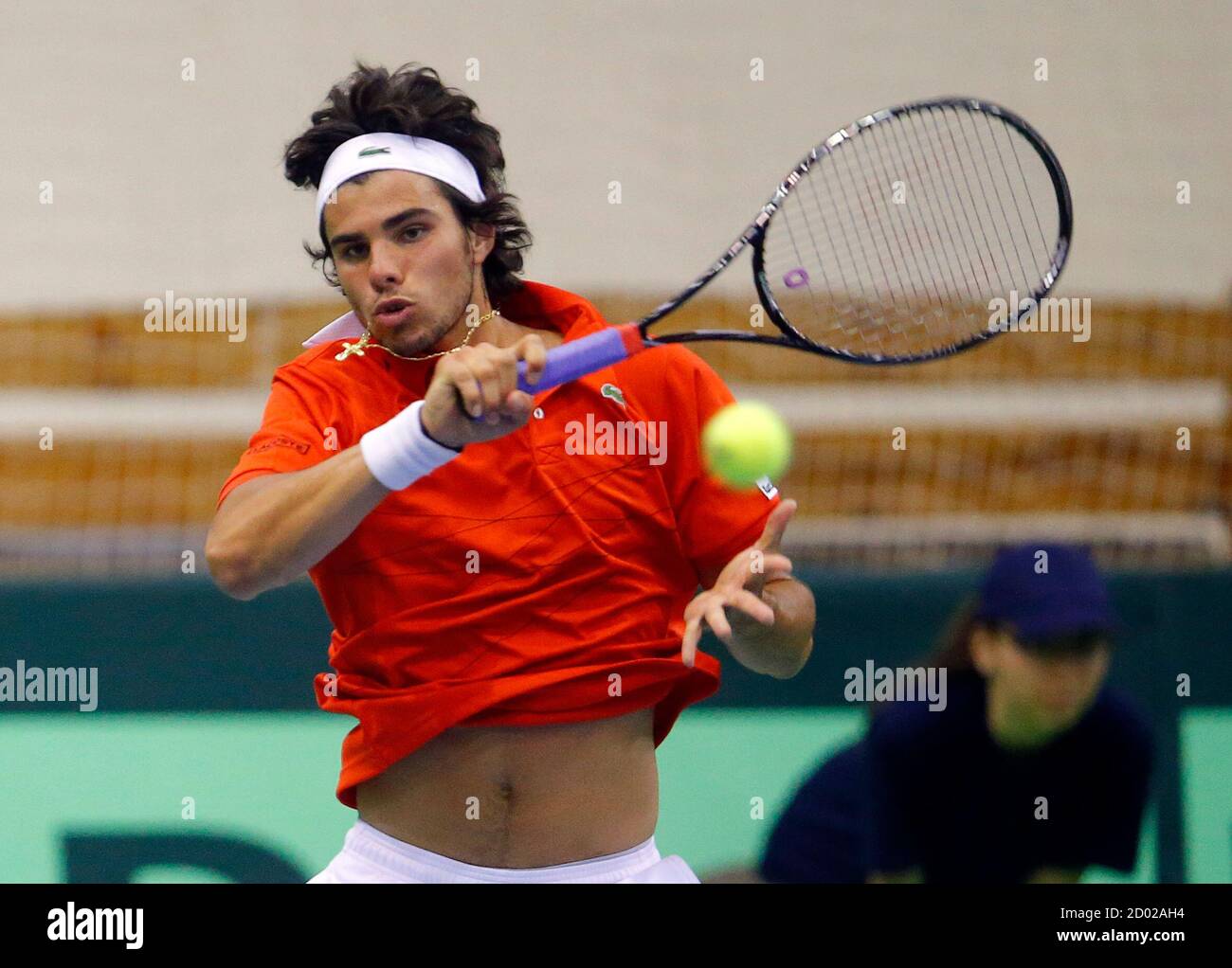 Udo Nastasi of Luxembourg hits a return to Attila Balazs of Hungary during  their Davis Cup Europe/Africa Zone II match in Budapest April 5, 2013.  REUTERS/Laszlo Balogh (HUNGARY - Tags: SPORT TENNIS