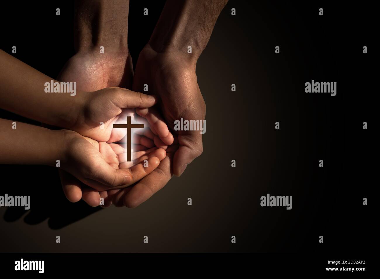 Praying and teaching, child and adult praying together Stock Photo - Alamy