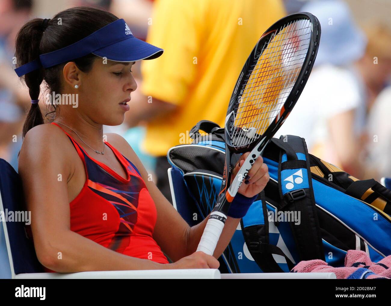 Ana Ivanovic of Serbia checks her racquet during a break in play against  Christina McHale of the U.S. at the U.S. Open tennis championships in New  York August 31, 2013. REUTERS/Ray Stubblebine (