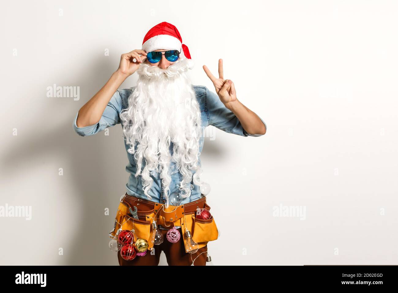 Santa with construction tools, santa repairman Stock Photo - Alamy