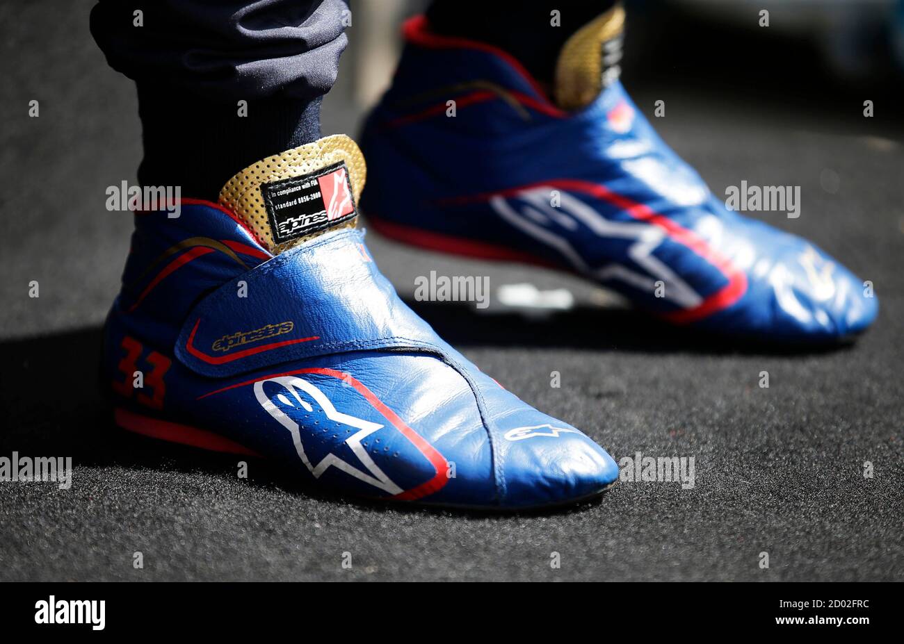 The racing boots of Toro Rosso Formula One driver Max Verstappen of the  Netherlands is seen during a photo session before the Australia Formula One  Grand Prix, at Melbourne's Albert Park Track,