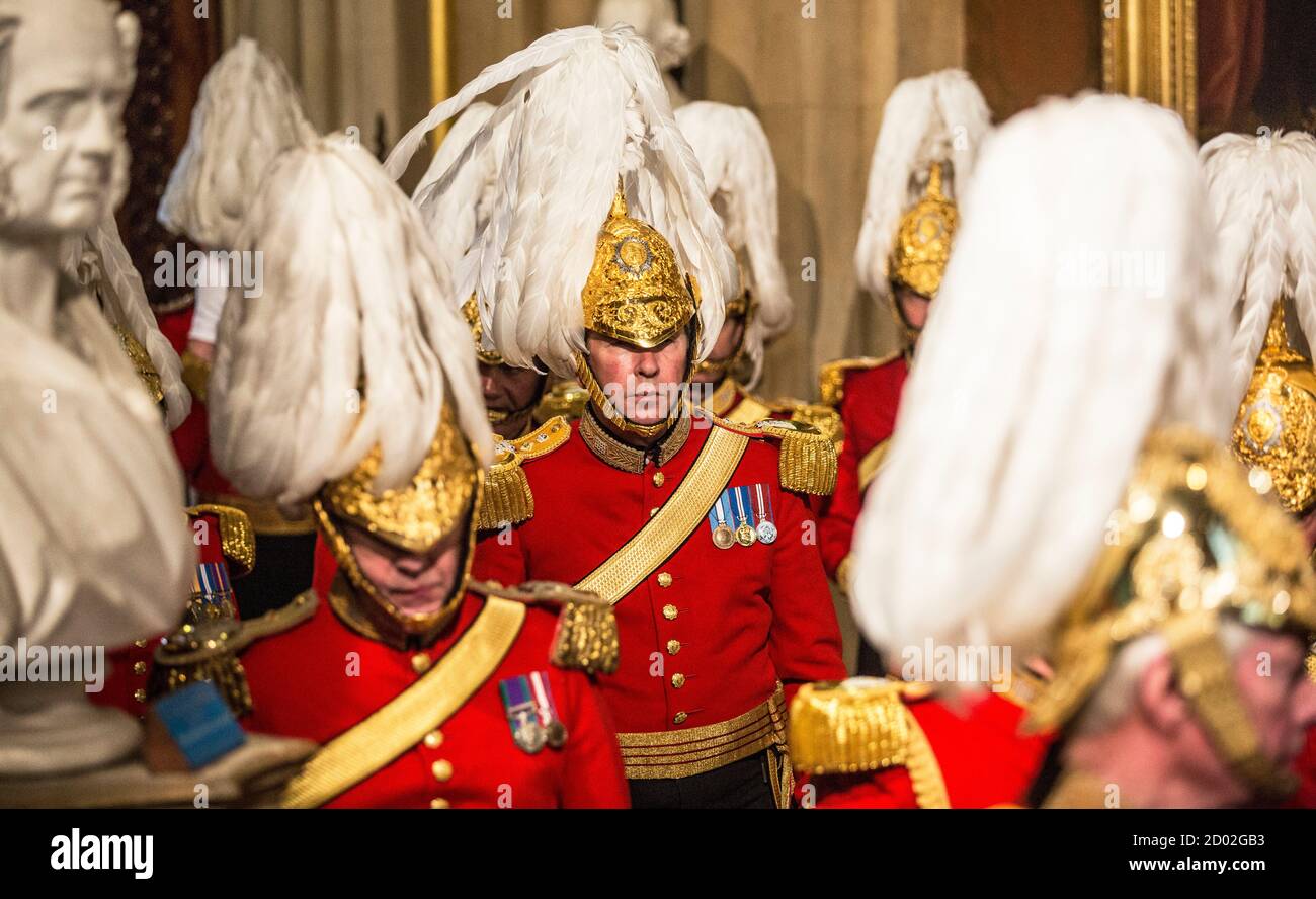 Members of the Queen's bodyguard, the "Gentlemen at Arms", await the