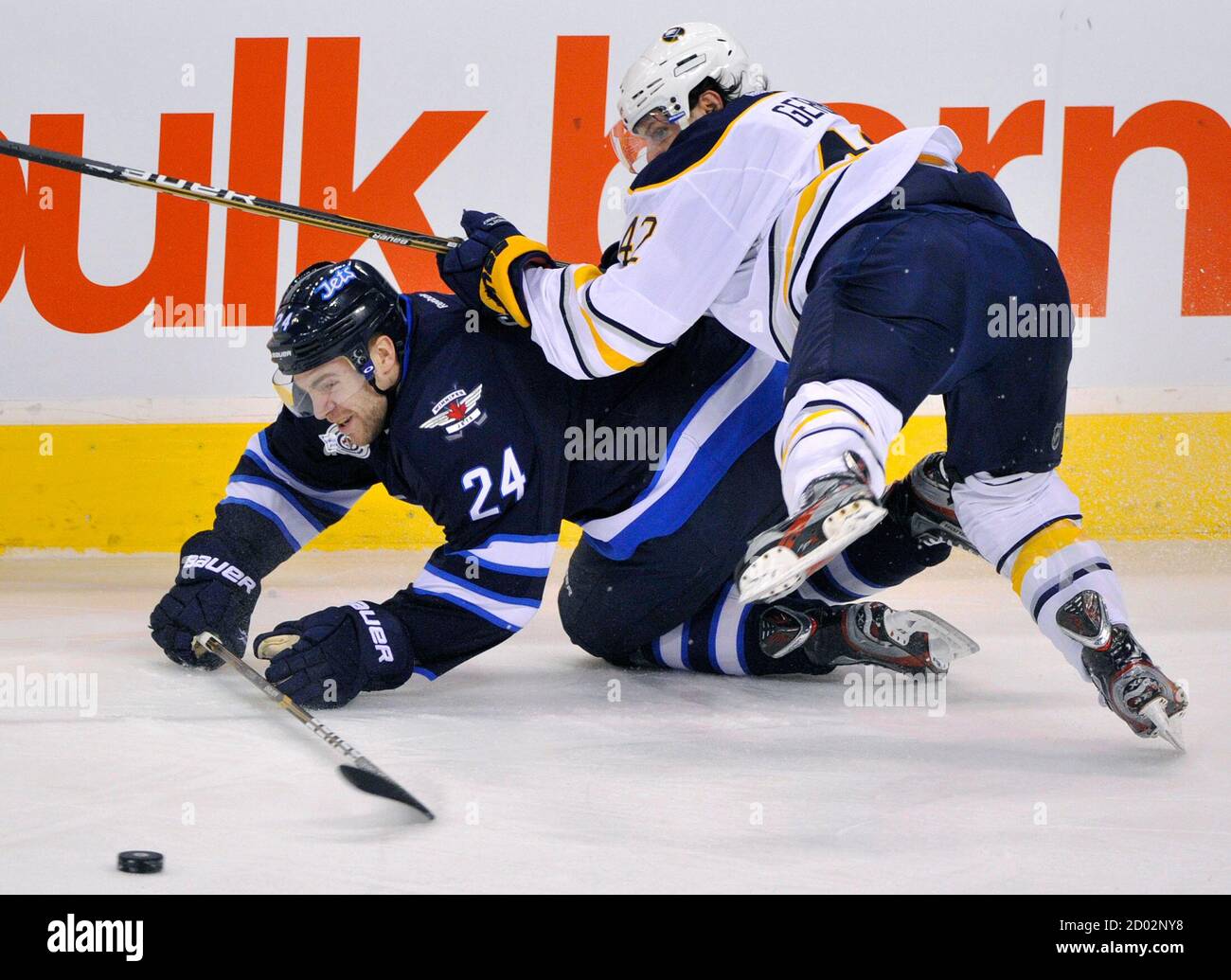 Winnipeg Jets' Grant Clitsome (24) is checked by Buffalo Sabres' Nathan  Gerbe during the first period