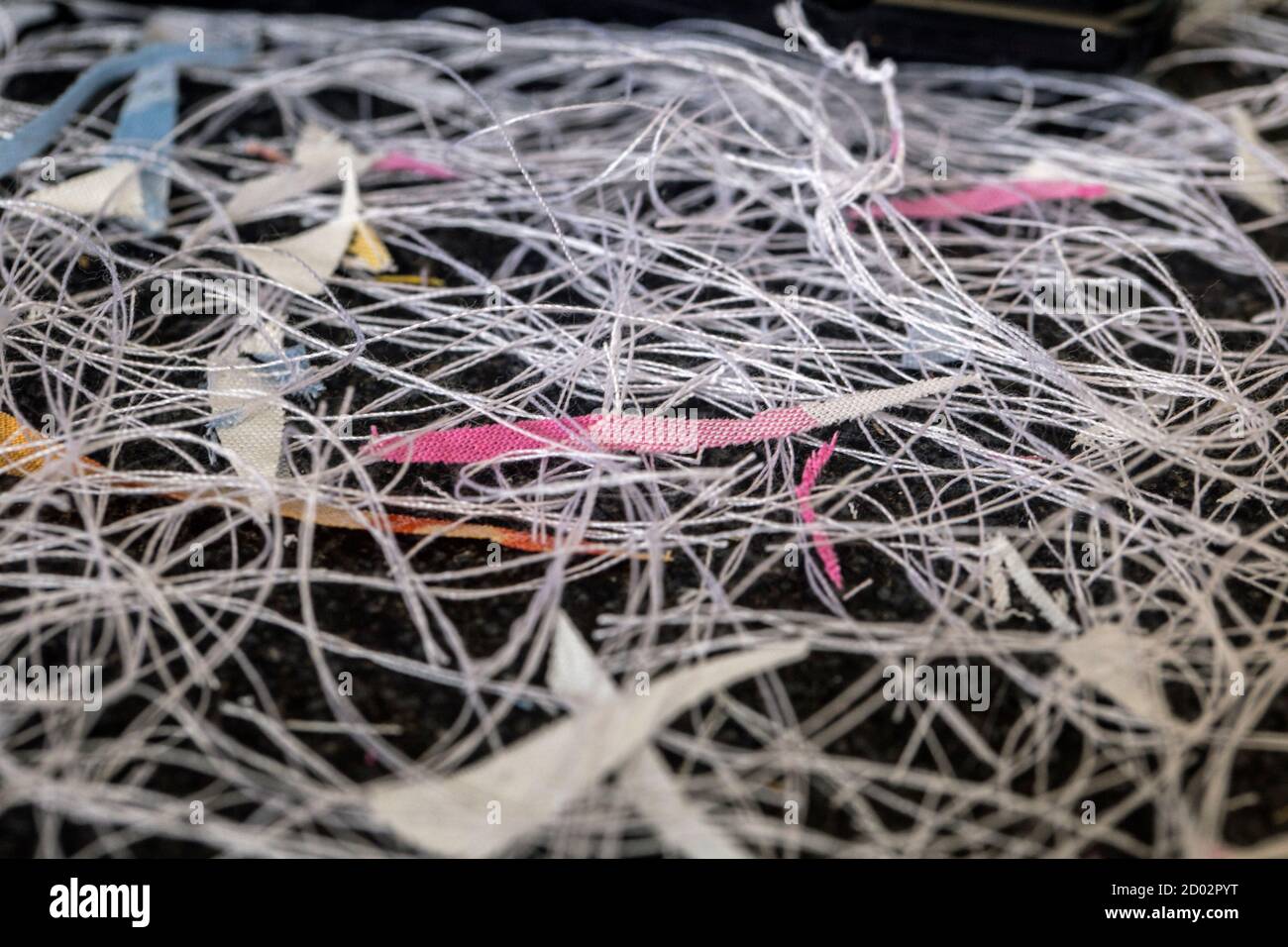 Threads on the floor - evidence of a cottage industry Stock Photo - Alamy
