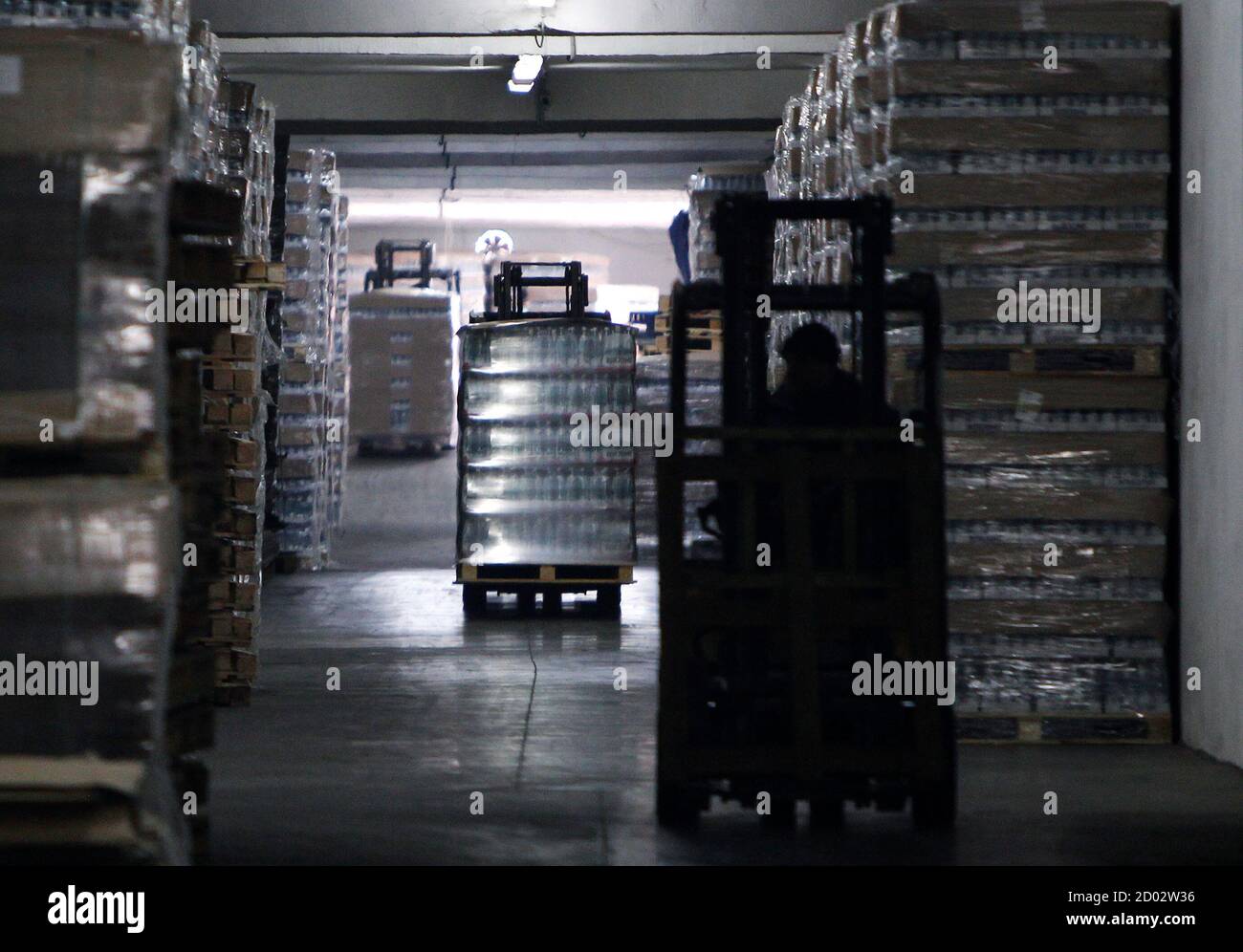 Employees Drive Forklifts At A Warehouse Of The Ids Borjomi Georgia's Factory In The Town Of Borjomi, Some 150 Km (93 Miles) Southwest Of Tbilisi, January 30, 2013. If There's A Secret