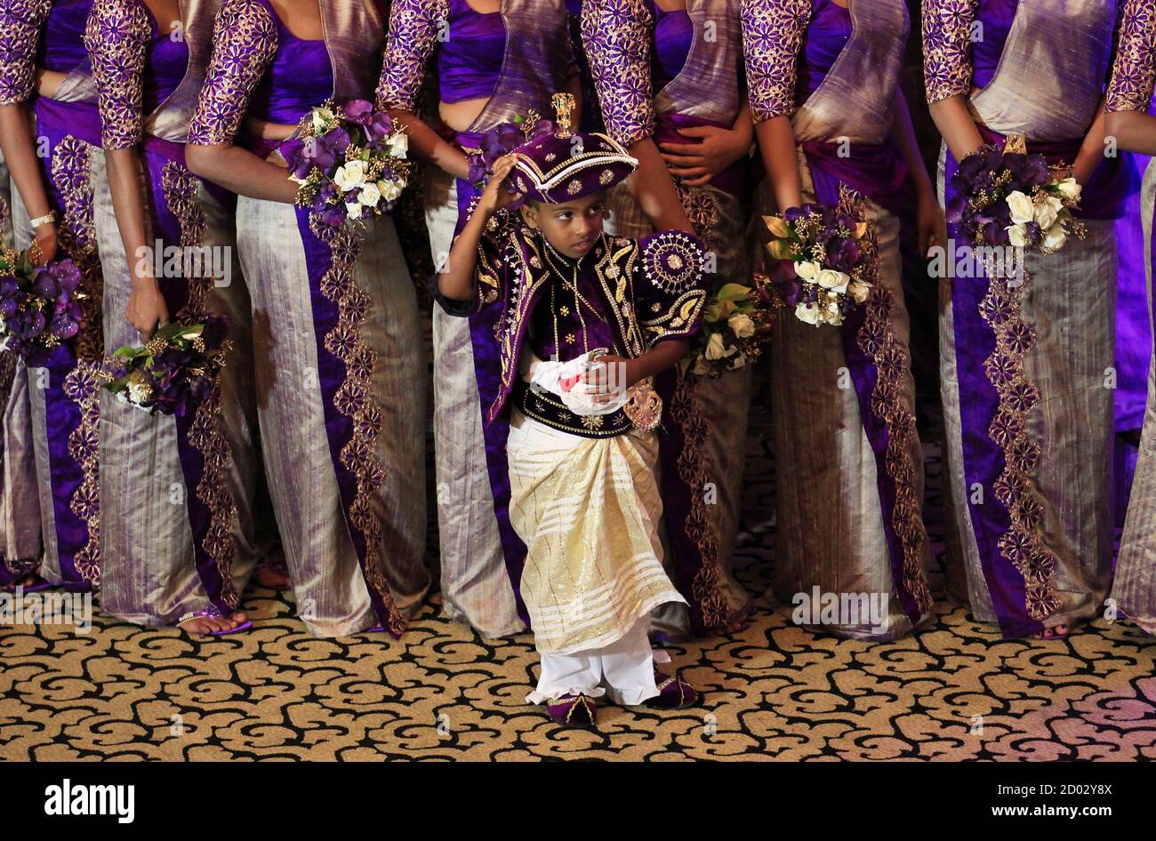 Sri Lankan Bride High Resolution Stock Photography And Images Alamy Sri lankan best classified ad site. https www alamy com a page boy waits to take a photo during a wedding ceremony for sri lankan couple nisansala and nalin as they break the guinness record for a wedding with the most bridesmaids for a bride in negombo november 8 2013 with 126 bridesmaids 25 best men accompanied by 20 page boys and 23 flower girls the wedding ceremony broke a previous record of having 96 bridesmaids for a bride at a wedding in thailand reutersdinuka liyanawatte sri lanka tags society image378693418 html