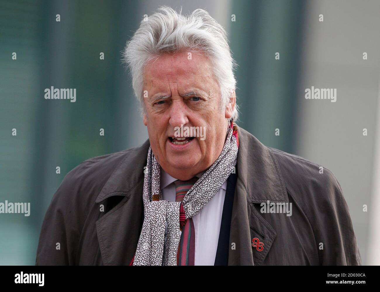 Michael Mansfield QC arrives for the opening day of the Hillsborough Inquest in Warrington, northern England March 31, 2014. New inquests into the 1989 Hillsborough disaster, that claimed the lives of 96 men, women and children, are scheduled to open today.   REUTERS/Phil Noble   (BRITAIN - Tags: DISASTER SOCIETY SPORT SOCCER) Stock Photo
