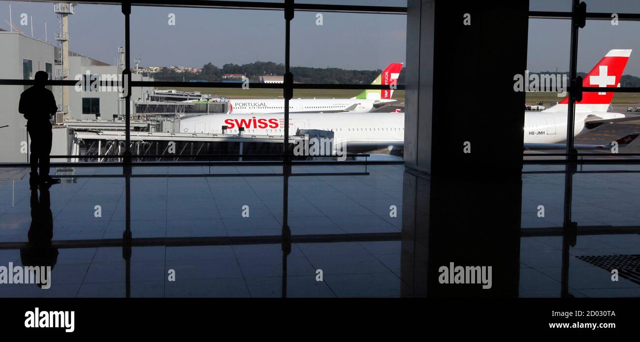 A passenger stands at Terminal 3 at Guarulhos International airport in Sao Paulo May 20, 2014. The new terminal includes 20 departure gates, a runway with a capacity for 34 aircraft, and is expected to receive 12 million passengers each year. REUTERS/Paulo Whitaker (BRAZIL - Tags: SPORT SOCCER WORLD CUP TRANSPORT) Stock Photo