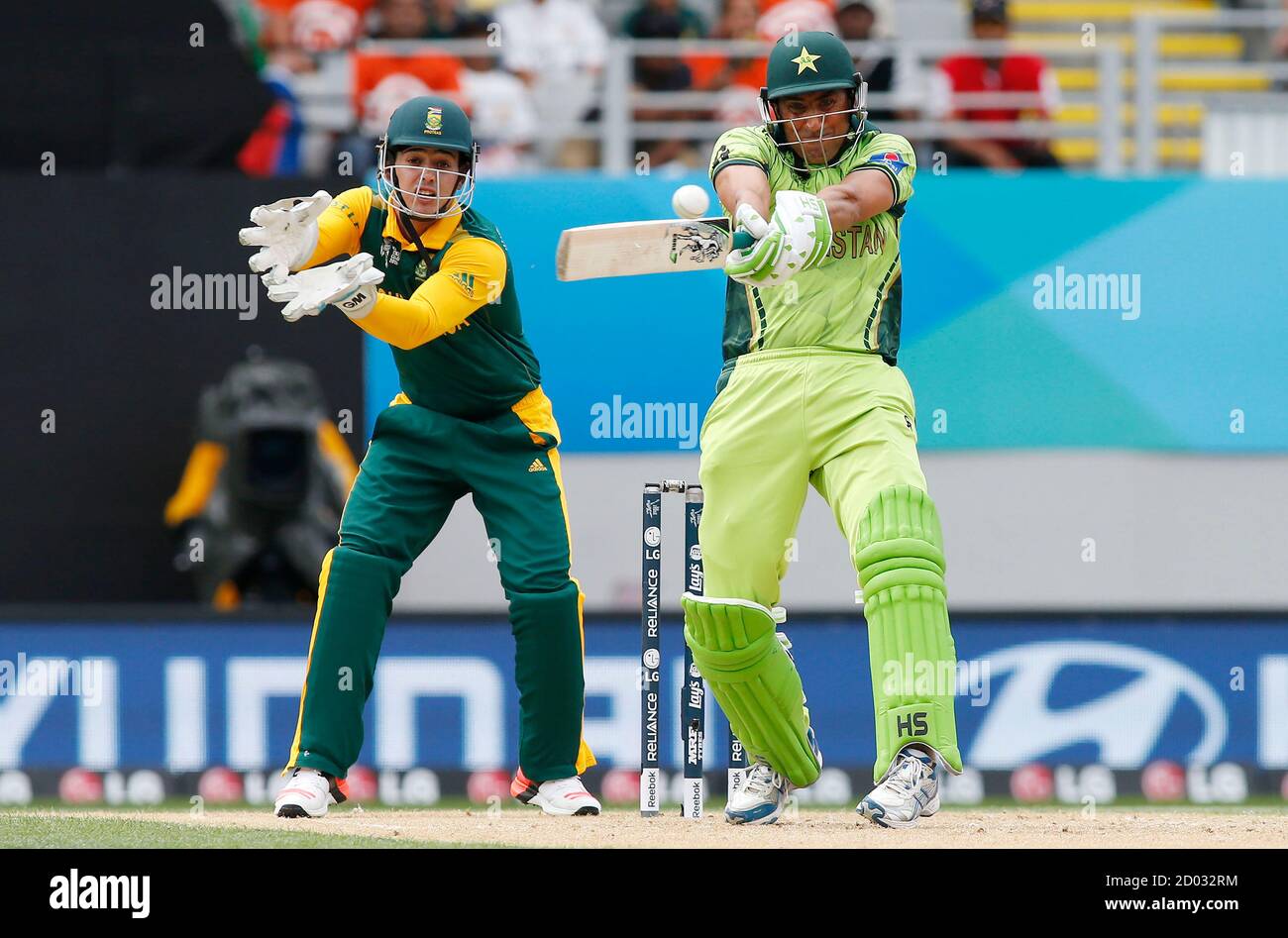 Pakistan's Younis Khan hits a four watched by South Africa's Quinton De Kock  (L) during their