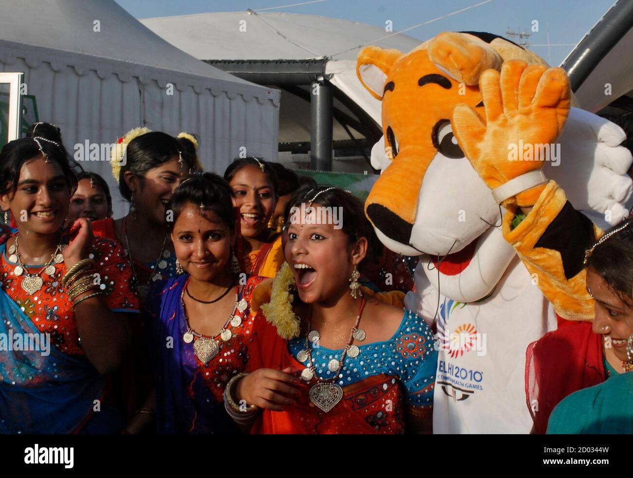 Indian artistes pose for a picture with the mascot of Commonwealth Games at  the athletes village in New Delhi September 27, 2010. The Games were  supposed to enhance India's image as a
