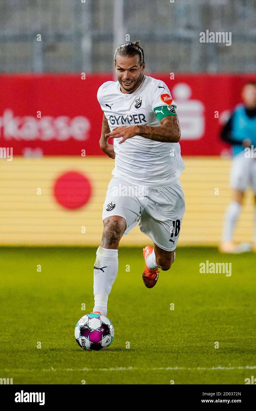 Sandhausen, Germany. 02nd Oct, 2020. Football: 2nd Bundesliga, SV Sandhausen - FC St. Pauli, 3rd matchday, Hardtwaldstadion. Sandhausens Dennis Diekmeier plays the ball. Credit: Uwe Anspach/dpa - IMPORTANT NOTE: In accordance with the regulations of the DFL Deutsche Fußball Liga and the DFB Deutscher Fußball-Bund, it is prohibited to exploit or have exploited in the stadium and/or from the game taken photographs in the form of sequence images and/or video-like photo series./dpa/Alamy Live News Stock Photo