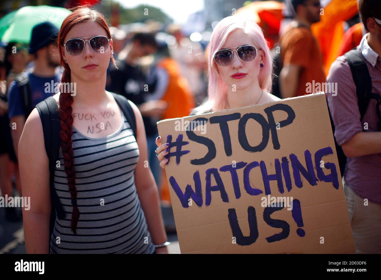 Two protesters attend a demonstration against secret monitoring programmes PRISM, TEMPORA, INDECT and showing solidarity with whistleblowers Edward Snowden, Bradley Manning and others in Berlin July 27, 2013. REUTERS/Pawel Kopczynski (GERMANY  - Tags: CIVIL UNREST) Stock Photo