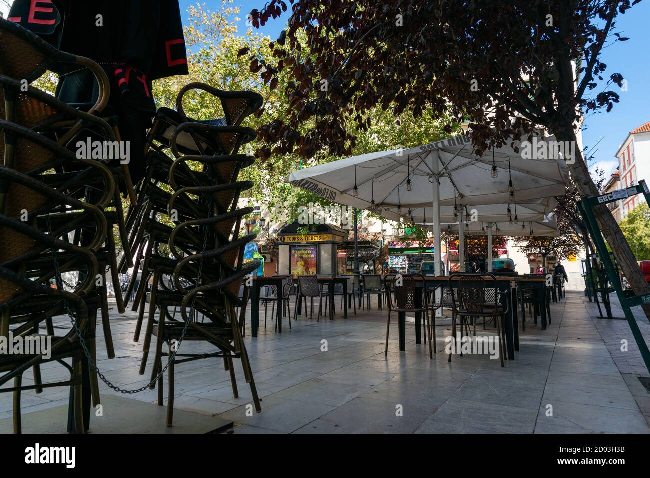 A view of an empty restaurant.Today in Madrid the confinement measures required by the government to control the pandemic came into effect. Restriction of entry and exit in residential areas, reduction of social and family gatherings to a maximum of six people, restaurants will close at 10 pm and have a maximum capacity of 50%. Stock Photo
