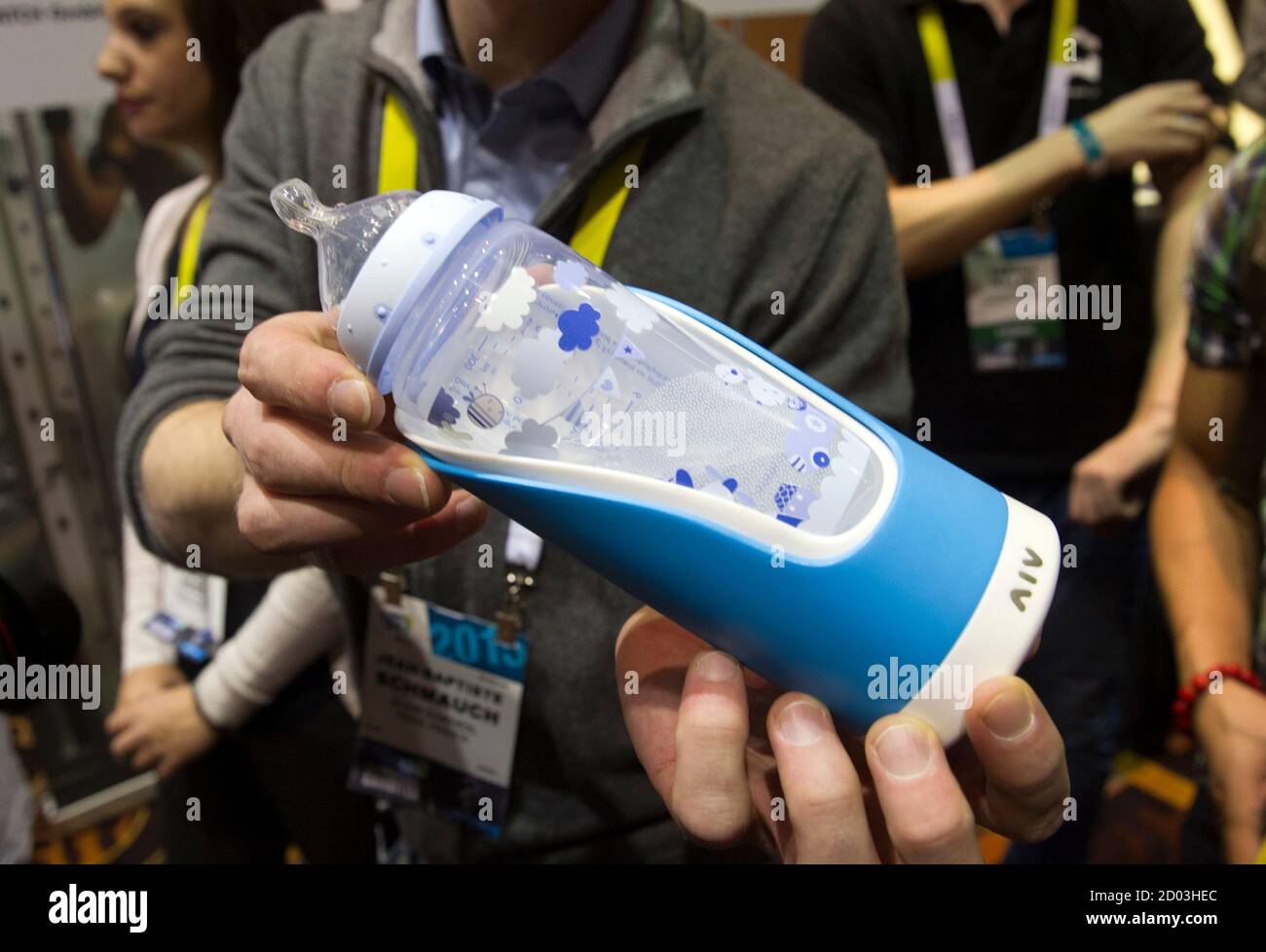 A baby bottle with a GlGl bottle holder is displayed during the 2015 International Consumer Electronics Show (CES) in Las Vegas, Nevada January 4, 2015. The holder sends a variety of information to a parent's smart phone and can help reduce colic by finding the optimal feeding angle, a representative said. REUTERS/Steve Marcus (UNITED STATES - Tags: SCIENCE TECHNOLOGY BUSINESS) Stock Photo