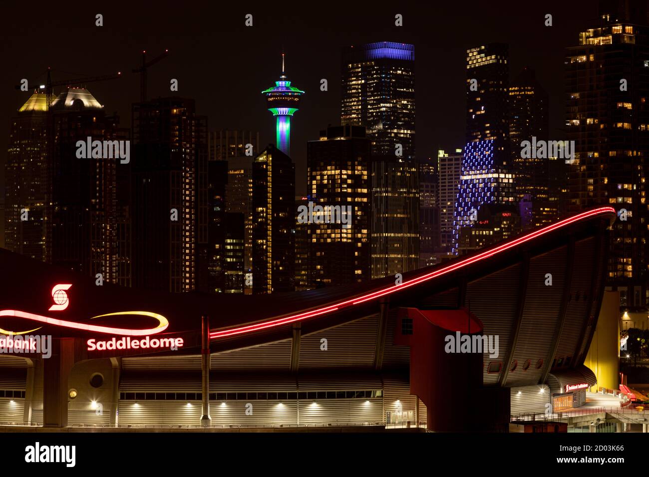 Calgary Saddledome, with the Calgary Tower and downtown Calgary in the