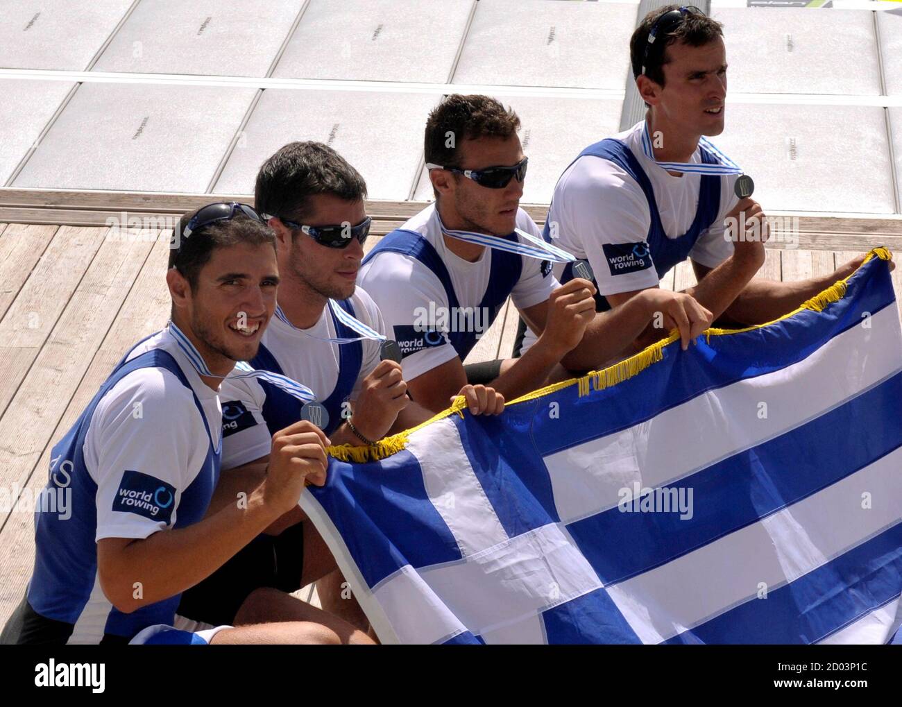 Stergios Papachristos, Ioannis Tsilis, Georgios Tziallas and Ioannis  Christou of Greece pose with their silver medals after the Men's Four final  at the World Rowing Championships in Bled September 4, 2011. REUTERS/Srdjan