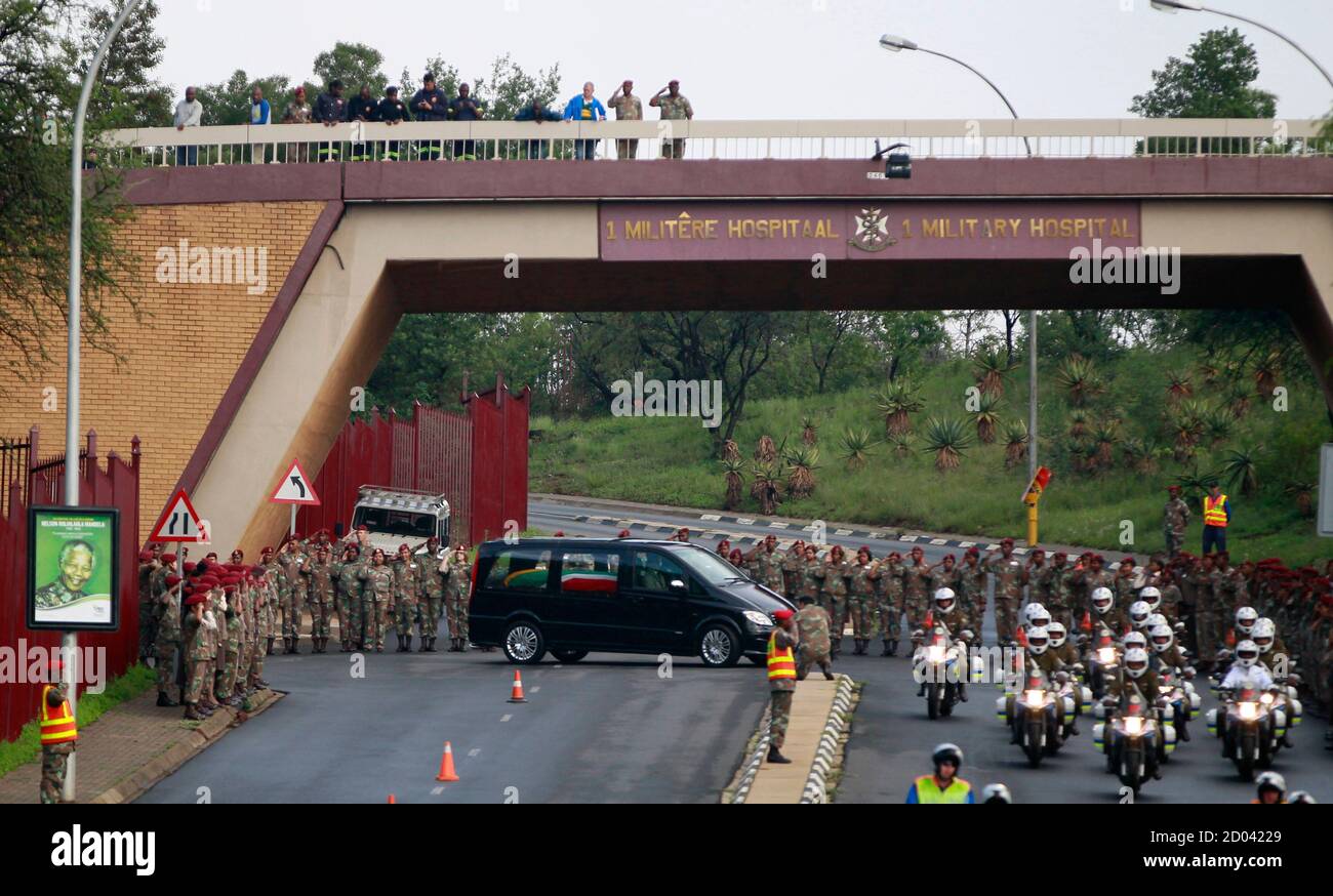 Military outriders escort the funeral cortege carrying the coffin of former South African President Nelson Mandela as it leaves the 1 Military Hospital on the outskirts of Pretoria, December 11, 2013, on its way to the Union Buildings. REUTERS/Thomas Mukoya (SOUTH AFRICA - Tags: OBITUARY POLITICS TPX IMAGES OF THE DAY) Stock Photo