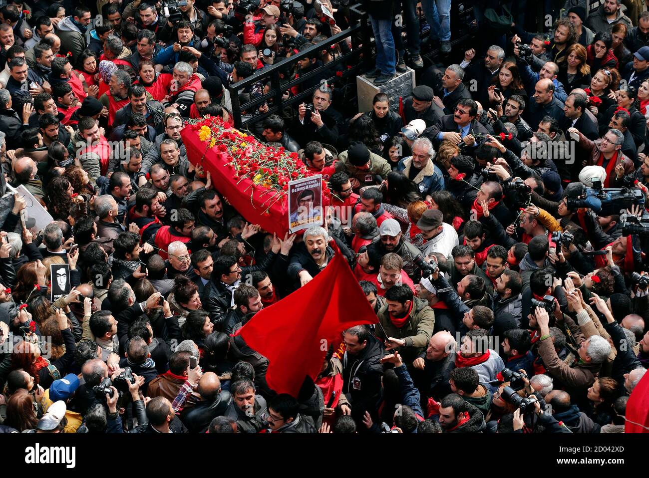 Mourners carry the coffin of Berkin Elvan during funeral ceremony in Okmeydani cemevi, an Alevi place of worship, in Istanbul March 12, 2014. Several thousand mourners gathered in central Istanbul on Wednesday for the funeral of Elvan, a 15-year-old boy wounded during anti-government demonstrations last summer whose death on Tuesday triggered protests across Turkey. REUTERS/Murad Sezer (TURKEY  - Tags: POLITICS CIVIL UNREST) Stock Photo