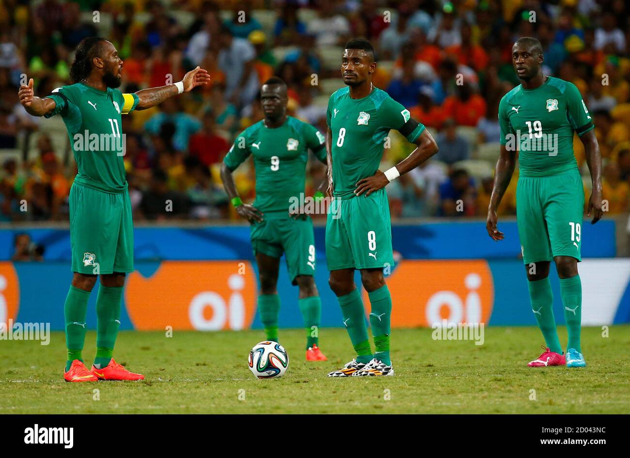 Ivory Coast's Didier Drogba reacts with his teammates (L-R) Cheick Tiote,  Salomon Kalou and Yaya Toure after their team conceded a goal to Greece  during their 2014 World Cup Group C soccer