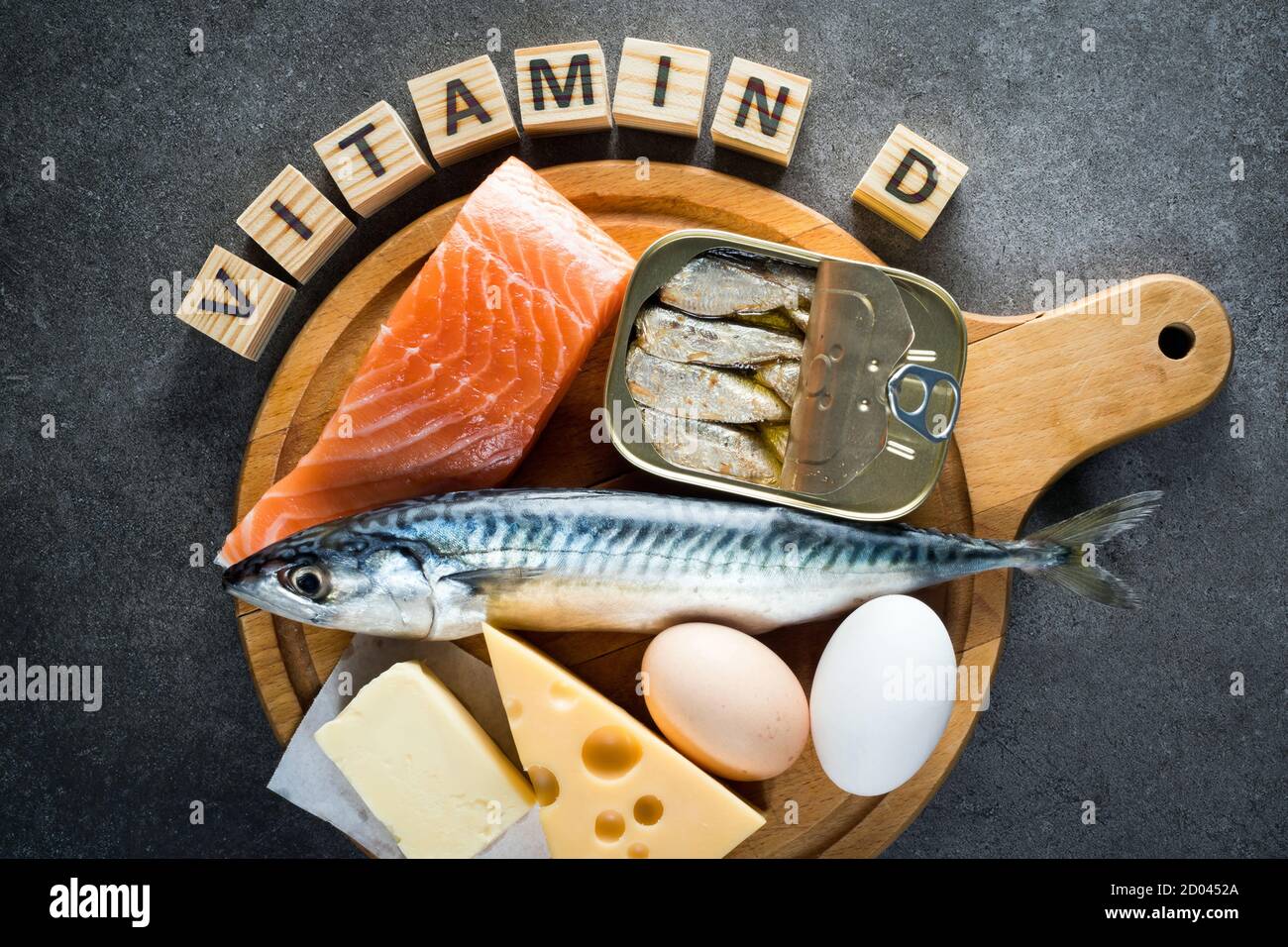 Foods rich in natural vitamin D as fish, eggs, cheese, butter, canned sardines Stock Photo