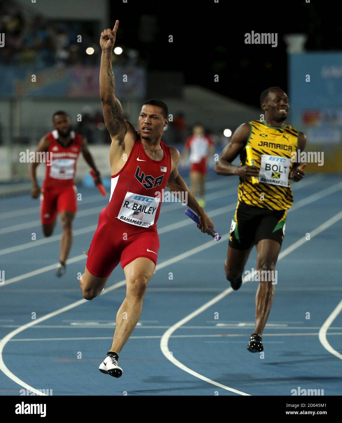 Ryan Bailey Of The U S L Celebrates As He Crosses The Finish Line Ahead Of Jamaica S Usain Bolt As The U S Win The 4x100 Meters Race At The Iaaf World Relays Championships
