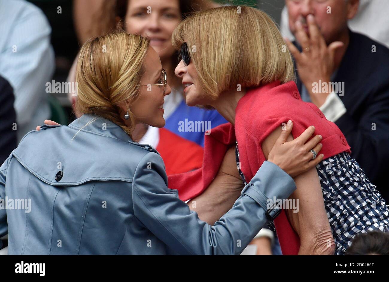 Editor of American Vogue Anna Wintour greets Jelena Djokovic, wife of Novak  Djokovic of Serbia before his Men's Singles Final match against Roger  Federer of Switzerland at the Wimbledon Tennis Championships in