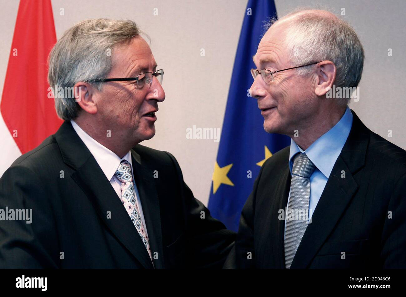 Luxembourg's Prime Minister and Eurogroup chairman Jean-Claude Juncker  talks to European Council President Herman Van Rompuy (R) as they pose  before their meeting at the EU Council in Brussels August 31, 2010.