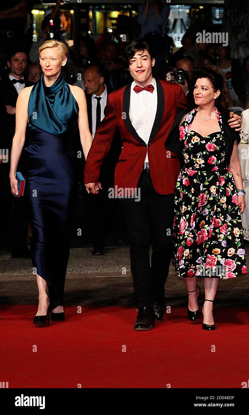 Director Lynne Ramsay (R) and cast members Ezra Miller (C) and Tilda  Swinton arrive on the red carpet for the screening of the film "We Need To  Talk About Kevin", in competition