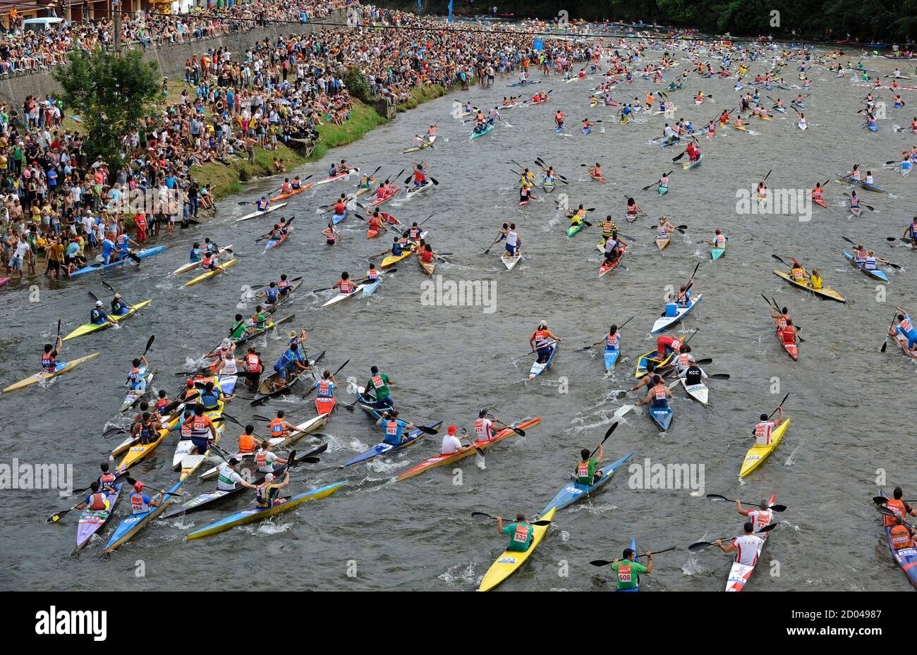 Canoeists start the annual International Descent of the River Sella in  Arriondas August 6, 2011. The race finished in Ribadesella in the northern  region of Asturias. REUTERS/Eloy Alonso (SPAIN - Tags: SPORT