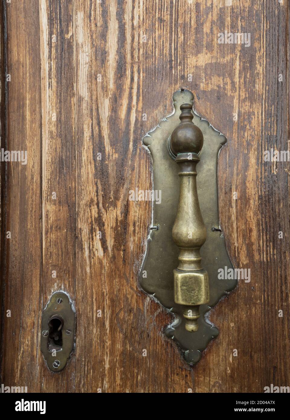 Antique brass handle on old wooden door worn by time Stock Photo Alamy