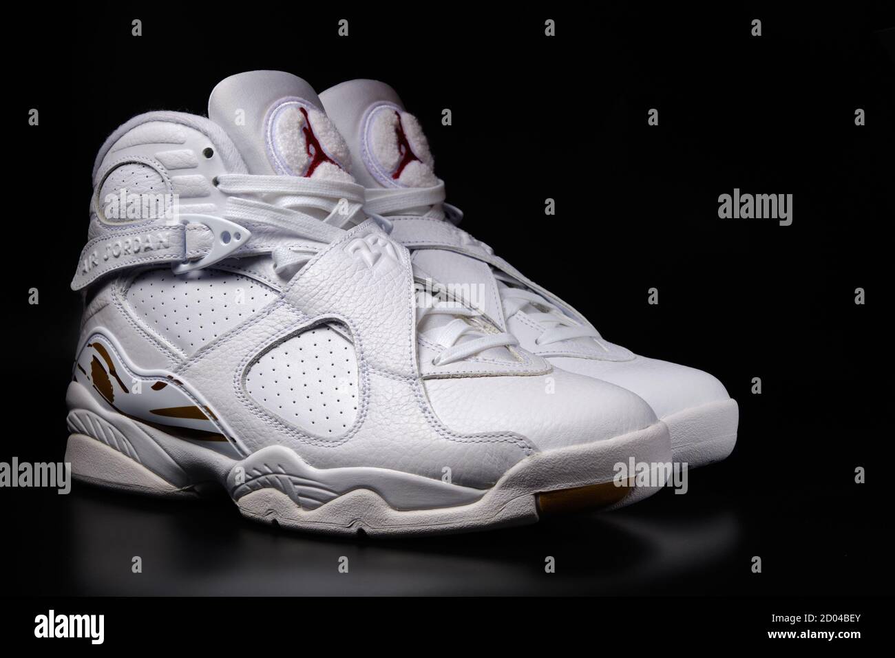 Nike Air Jordan 8 Retro OVO Drake White colorway sneakers on black  background illustrative editorial Stock Photo - Alamy