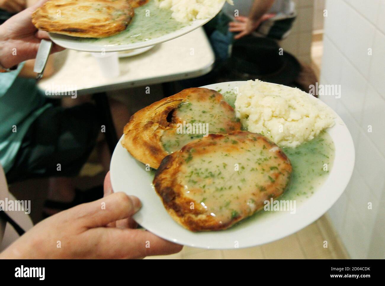 Pie Mash And Eels High Resolution Stock Photography And Images Alamy The top is puff or shortcrust. https www alamy com pies mash and liquor are delivered to a table at g kellys pie an mash shop in east london june 1 2012 each month the pie and mash club get together at a different traditional pie and mash shop and competitively eat as many eels pies mash liquor parsley sauce and pudding with custard as they can points are scored for each item completely eaten and points are deducted for ringing mobile phones or vomiting photograph was taken june 1 2012 reuterssuzanne plunkett britain tags society image378725695 html