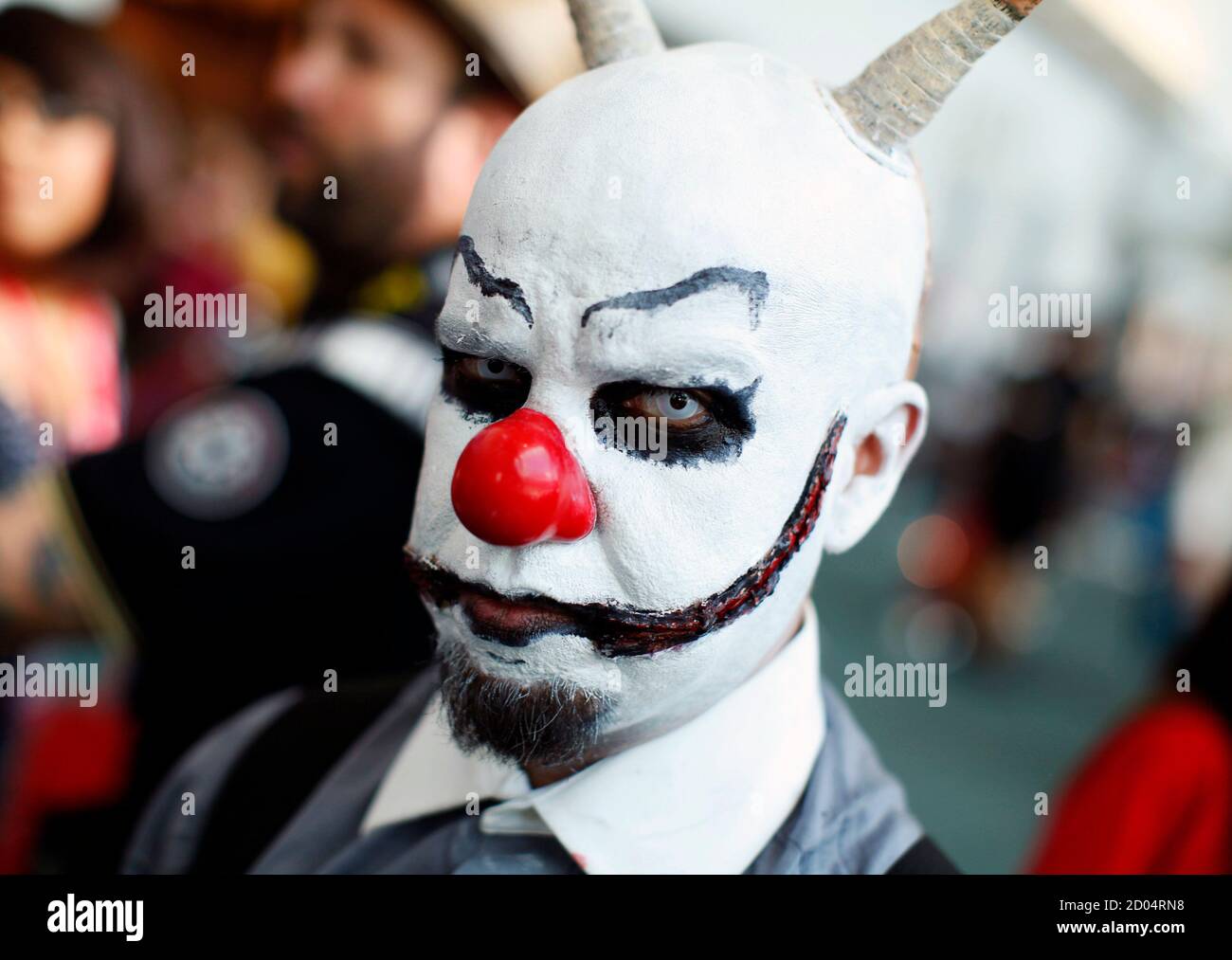 An attendee dressed in costume walks the Comic Con convention floor during the pop culture event in San Diego, California July 22, 2011.   REUTERS/Mike Blake  (UNITED STATES - Tags: ENTERTAINMENT SOCIETY IMAGES OF THE DAY) Stock Photo
