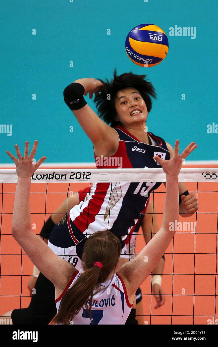 South Korea's Kim Hee-jin (19) prepares to spike the ball as Serbia's  Brankica Mihajlovic blocks during their women's Group B volleyball match at  the London 2012 Olympic Games at Earls Court July