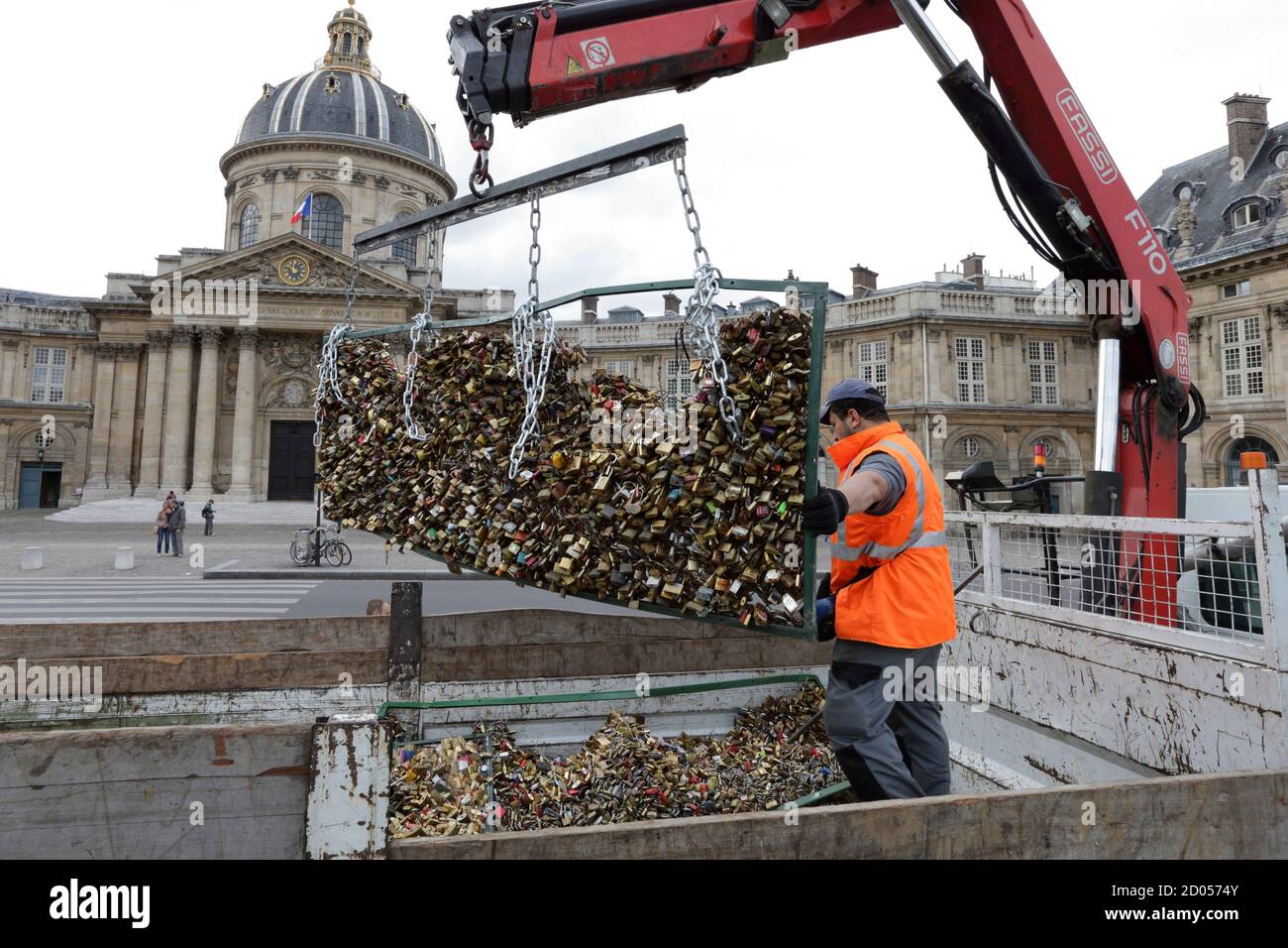 A workman places an iron grill panel covered with "love locks" from the Pont  des Arts into a truck in Paris, France, June 1, 2015. The bridge is closed  from June 1