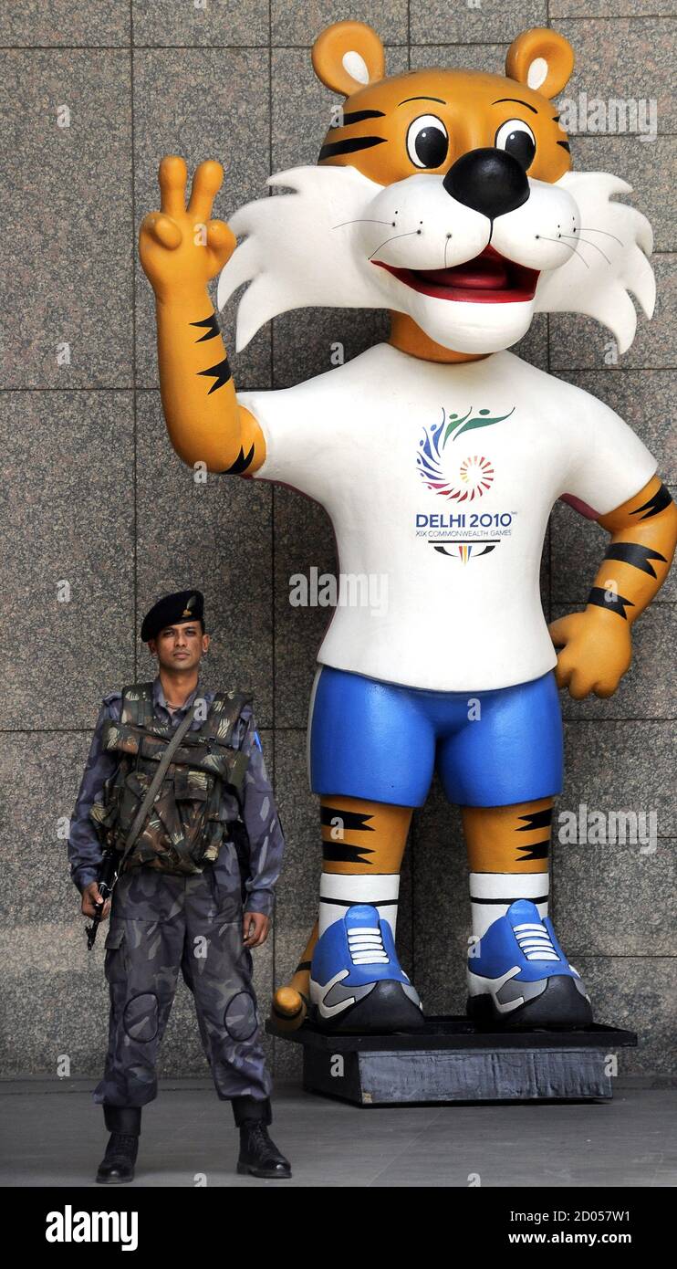A security personnel stands guard besides the mascot of 2010 Commonwealth  Games in New Delhi September 26, 2010. Commonwealth Games Federation  President Michael Fennell said on Saturday there was still a considerable