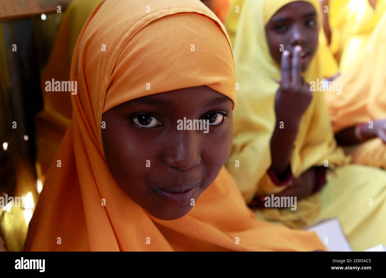 A Somali refugee girl attends Koran classes at the Liban integrated academy at the Ifo refugee camp in Dadaab, near the Kenya-Somalia border, August 2, 2011. The Horn of Africa food crisis shows the need to provide the world's poor with better access to family planning as part of efforts to prevent future tragedies, the head of the United Nations Population Fund (UNFPA) said. REUTERS/Thomas Mukoya (KENYA - Tags: SOCIETY CIVIL UNREST DISASTER ENVIRONMENT RELIGION) Stock Photo