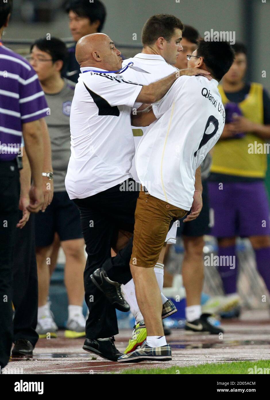 pics Karim Benzema Young https www alamy com a security guard holds the neck of a fan who was chasing real madrids karim benzema after a friendly soccer match against tianjin teda in tianjin august 6 2011 real madrid will help china set up the countrys biggest soccer academy in the southern city of guangzhou and send coaches to help train young talent according to local media reports reutersjason lee china tags sport soccer image378746052 html