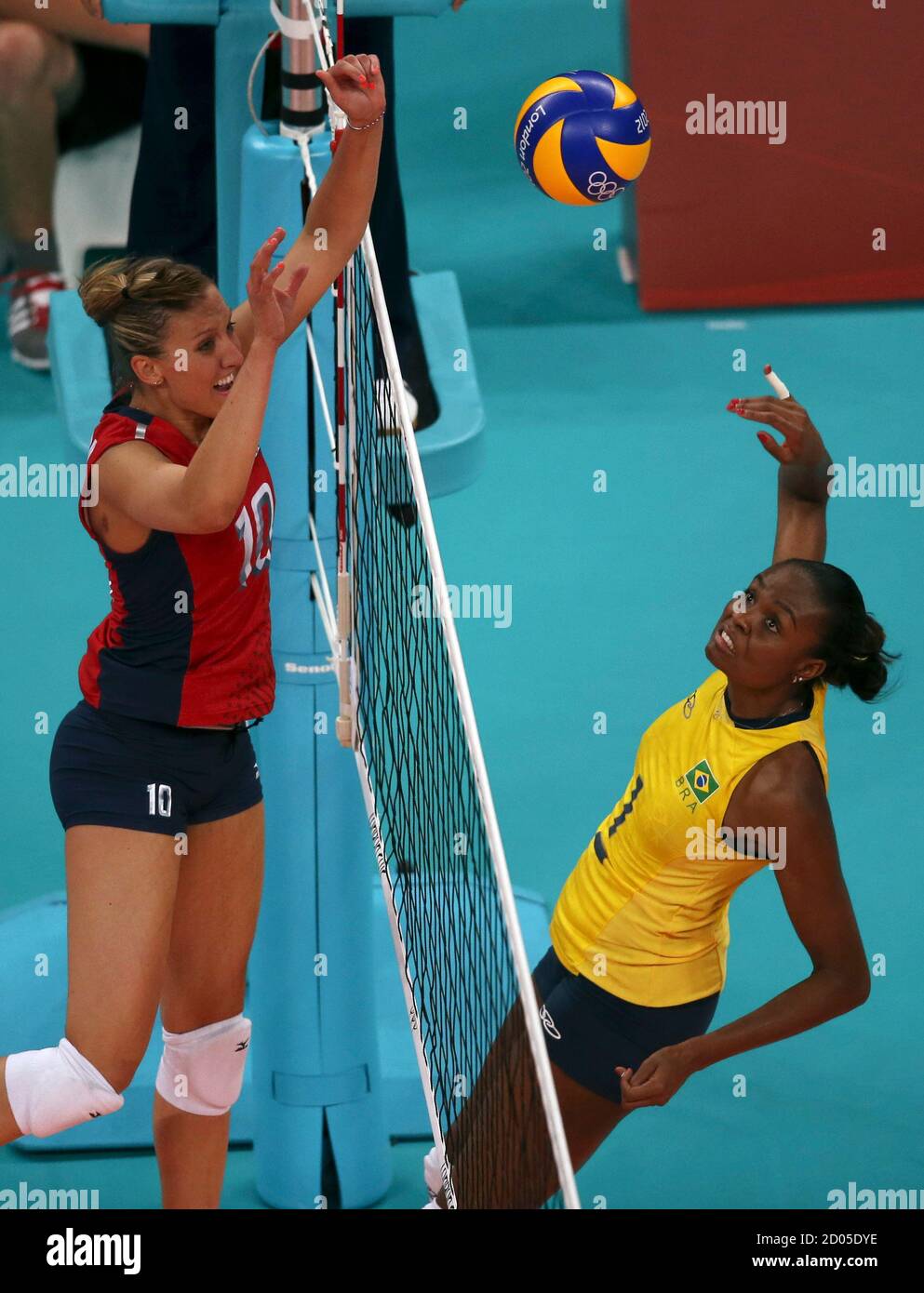 Jordan Larson Of The U S Blocks The Spike By Brazil S Captain Fabiana Claudino R During Their Women S Group B Volleyball Match At The London 12 Olympic Games At Earls Court July 30