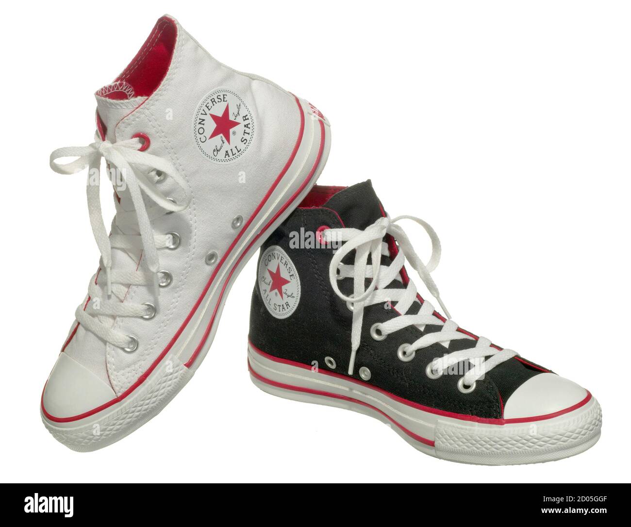 One black and one white converse shoe with red details and white laces  photographed on a white background Stock Photo - Alamy