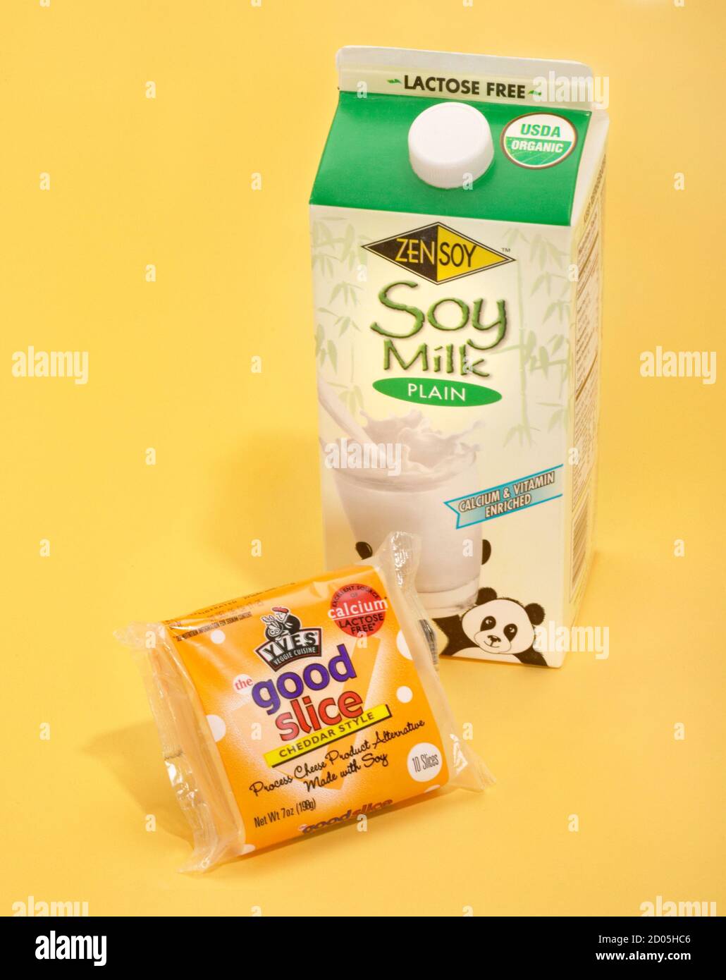 soy milk and soy cheese dairy alternative photographed on a yellow