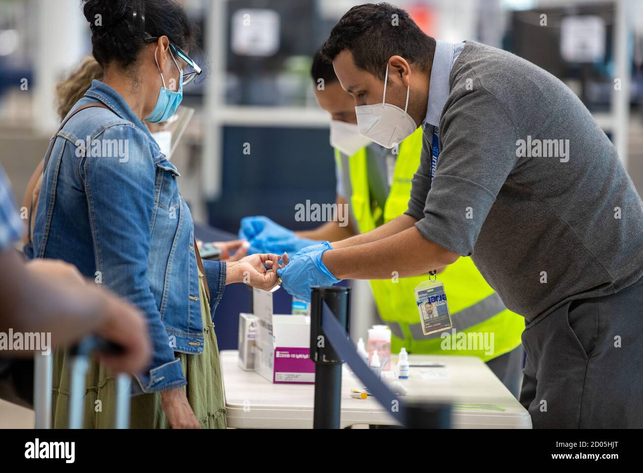 Cancun, Mexico. 01st Oct, 2020. CANCUN, MEXICO - OCTOBER 1: A health worker take a blood sample from a passenger to perform a rapid test to detect the SARS-COV2 that causes the Coronavirus disease (Covid-19). New safety measures are being taken at airports to prevent the spread of the virus on OCTOBER 1, 2020 in Cancun, Mexico Credit: The Photo Access/Alamy Live News Stock Photo