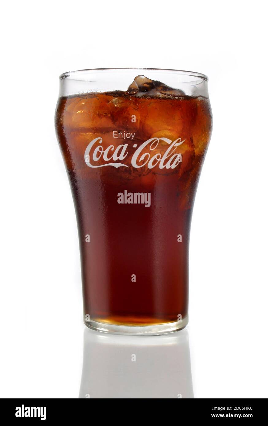 coca-cola in a glass with ice photographed on a white background Stock Photo