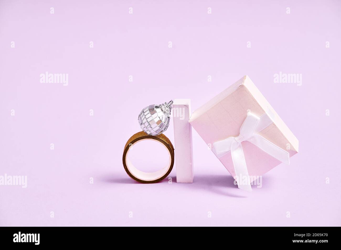 Silver disco ball , box, ring ang geometric shapes. 90s fashion. Engagement ring concept