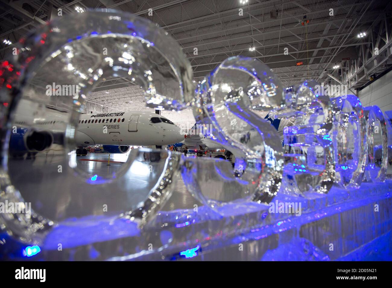 The Bombardier CS300 Aircraft is photographed through an ice sculpture prior to its' test flight in Mirabel February 27, 2015. Bombardier Inc confirmed on Thursday that it will begin long-delayed flight testing on Friday on the CS300 - the larger version of its new CSeries narrow-body jet. REUTERS/Christinne Muschi (CANADA - Tags: TRANSPORT BUSINESS) Stock Photo
