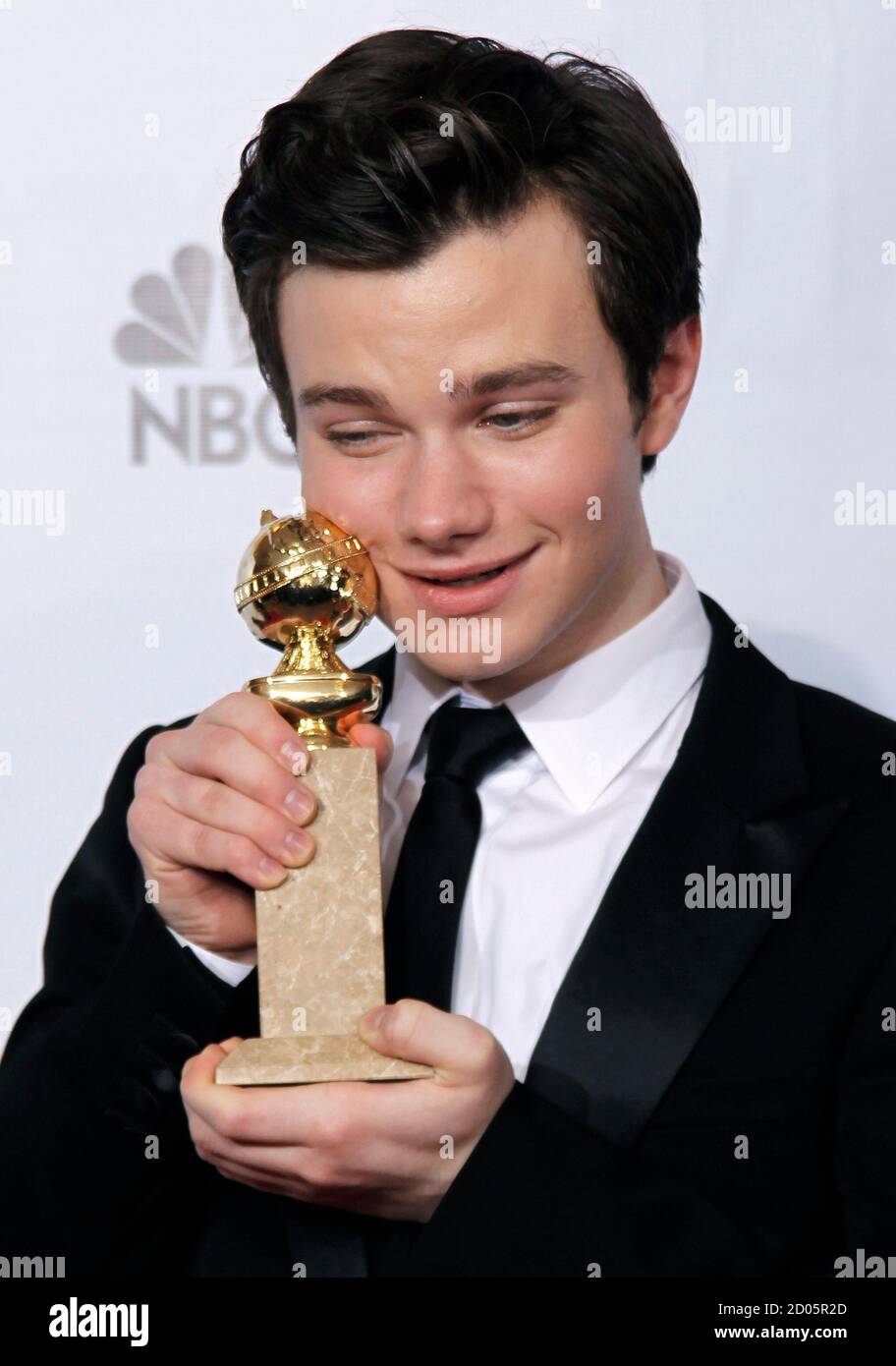Chris Colfer holds his award for best supporting actor for a tv series,  movie or miniseries for 'Glee,' backstage at the 68th annual Golden Globe  Awards in Beverly Hills, California, January 16,