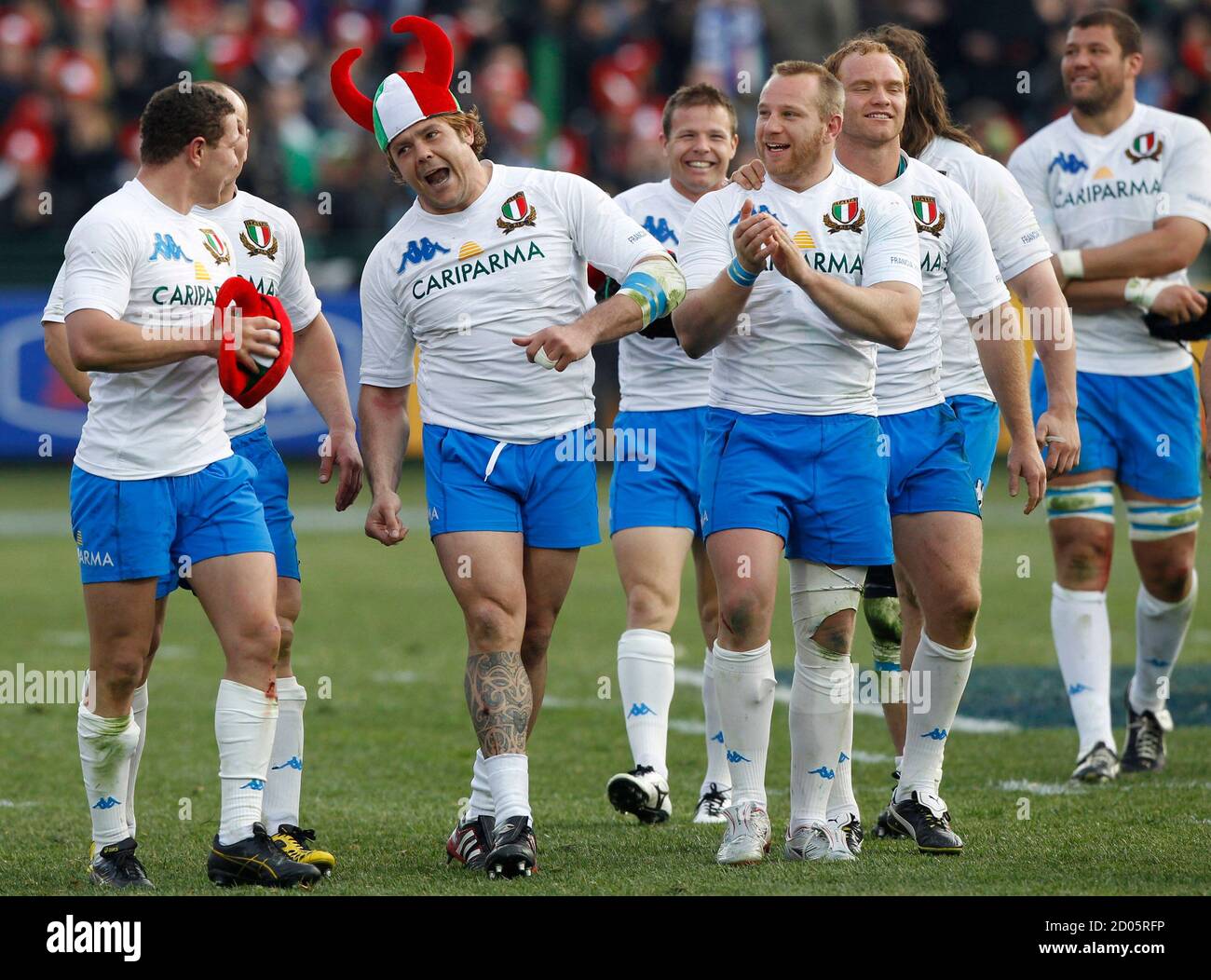 Italy's Andrea Lo Cicero celebrates wearing a viking cap with his teammates  after winning their Six Nations rugby union match against France at  Flaminio Stadium in Rome March 12, 2011. REUTERS/Alessandro Bianchi (