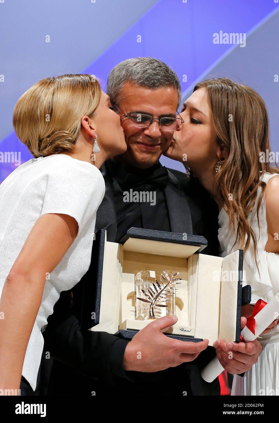 Actresses Lea Seydoux (L) and Adele Exarchopoulos (R) kiss director