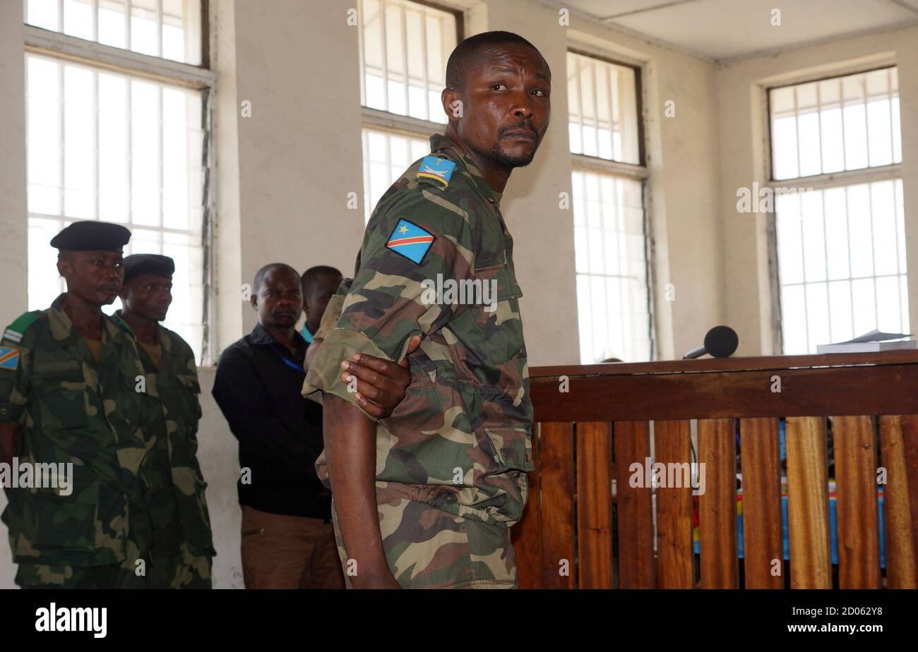 Lt. Salomon Bamdala of the Congolese army stands inside the military court  in the eastern city of Goma, July 23, 2013, where he was accused of  desecrating the corpse of a suspected